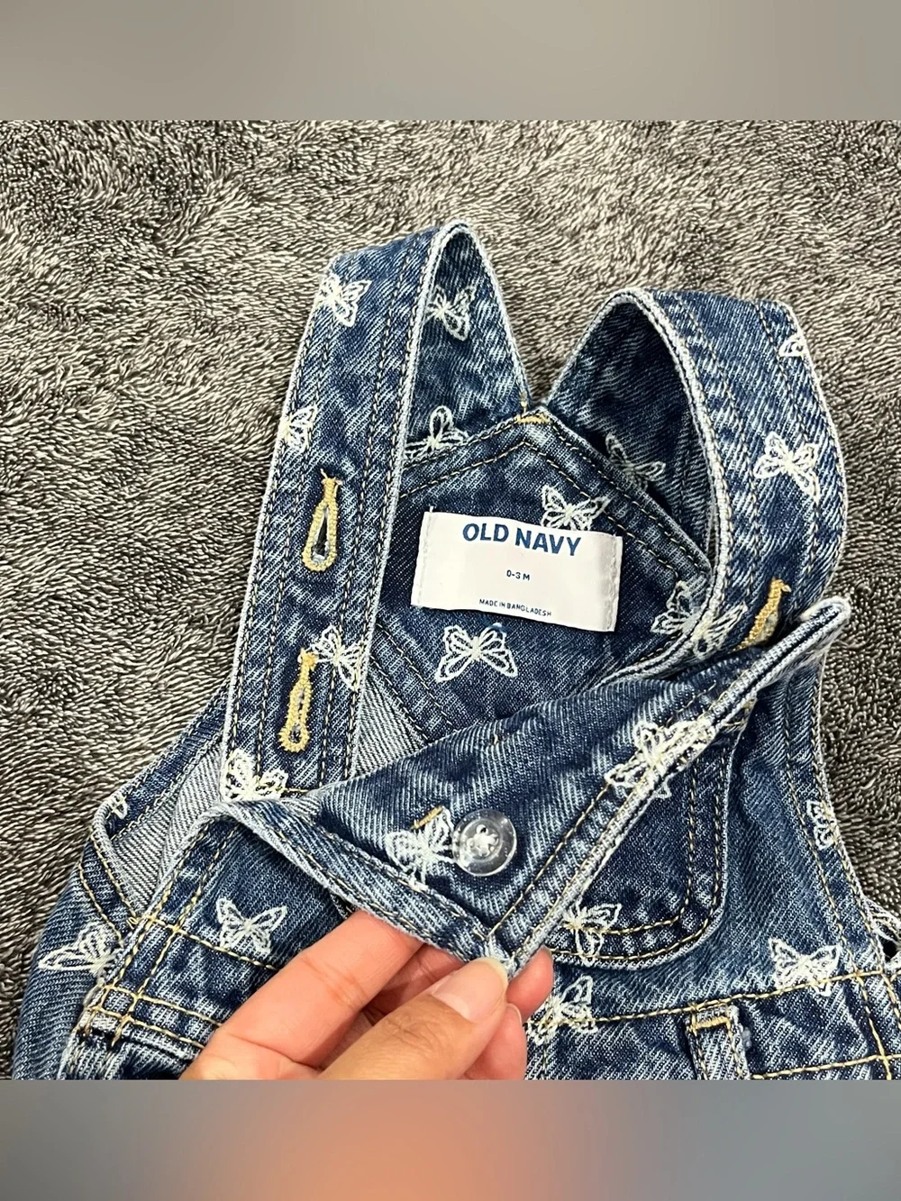 Old Navy jean romper for babies features an all-over white butterfly print 0-3